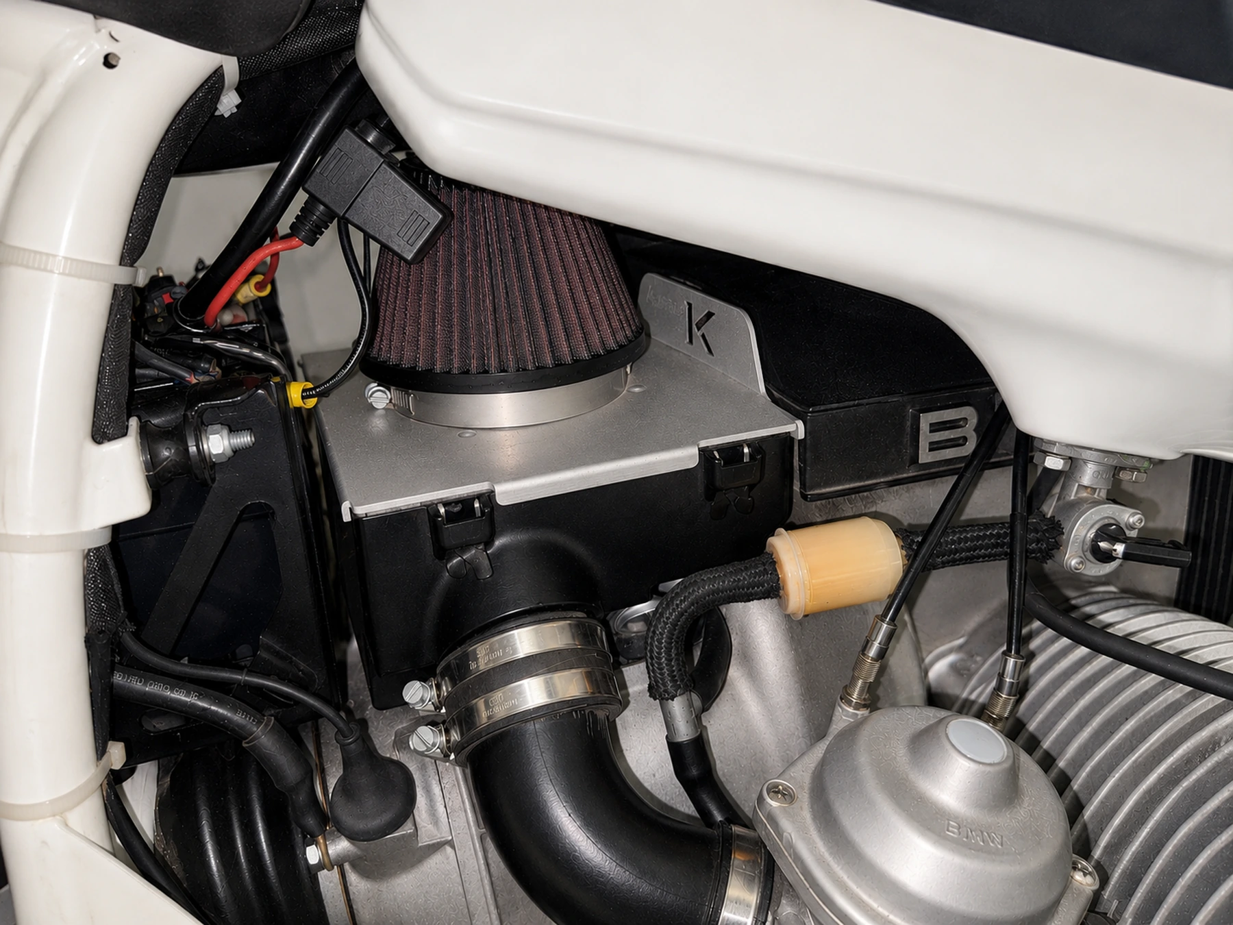 Close view of the Custom Konrad airbox installed beneath the fuel tank on the 1983 BMW R80ST