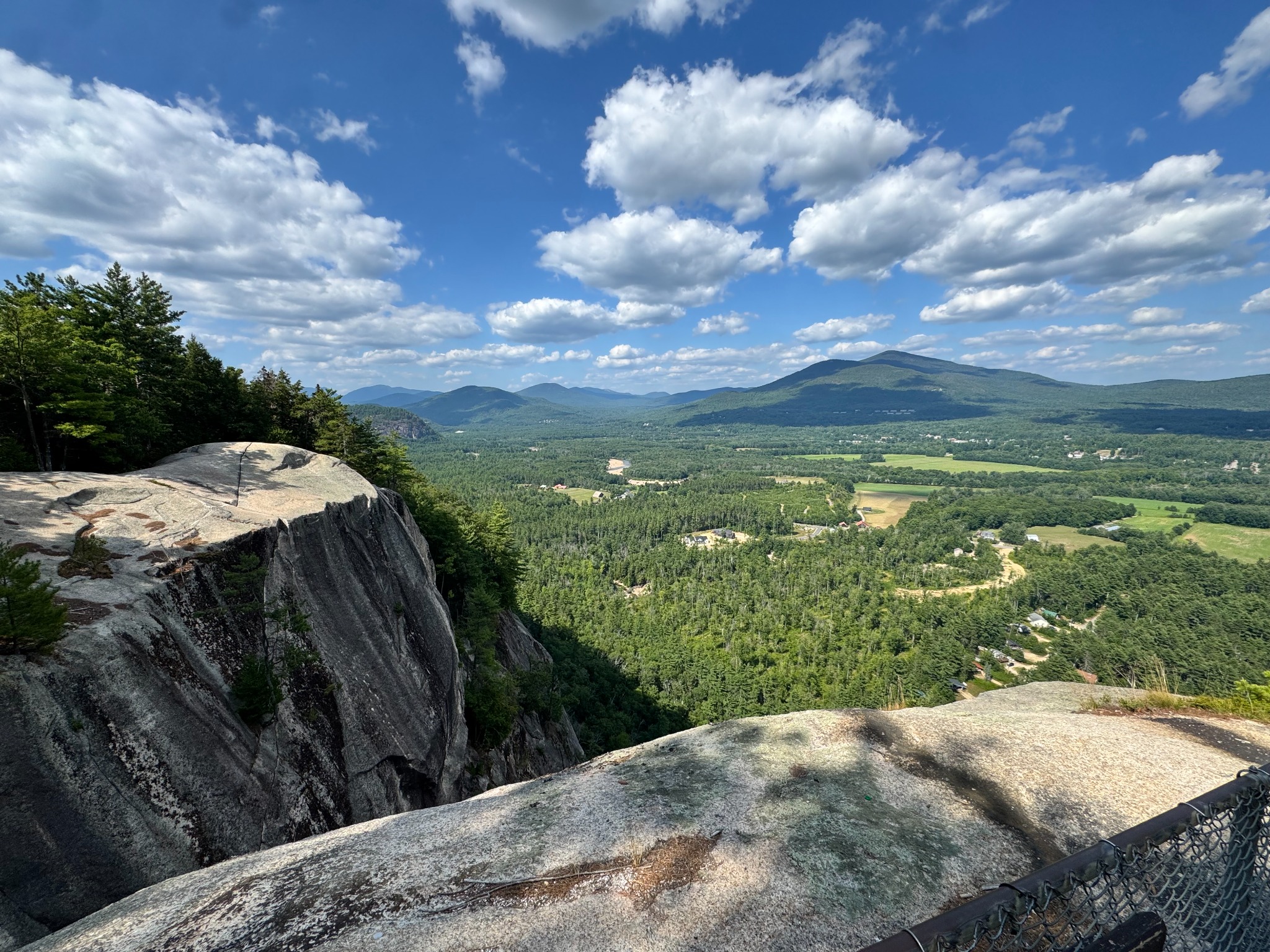 View from Cathedral Ledge across the Saco River Valley toward the White Mountains under cumulus clouds